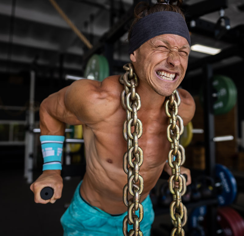 Man Lifting Heavy Equipment